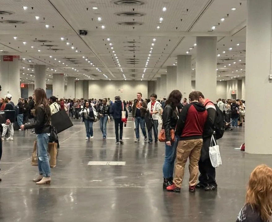 Crowd of students at National Portfolio Day in New York preparing for portfolio reviews