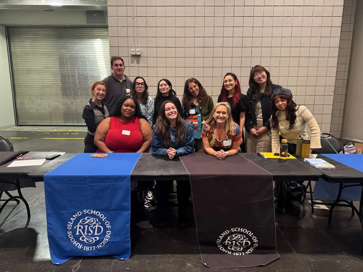 RISD booth at National Portfolio Day with signage and students waiting for portfolio reviews